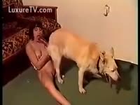 Redhead blowing her own dog
